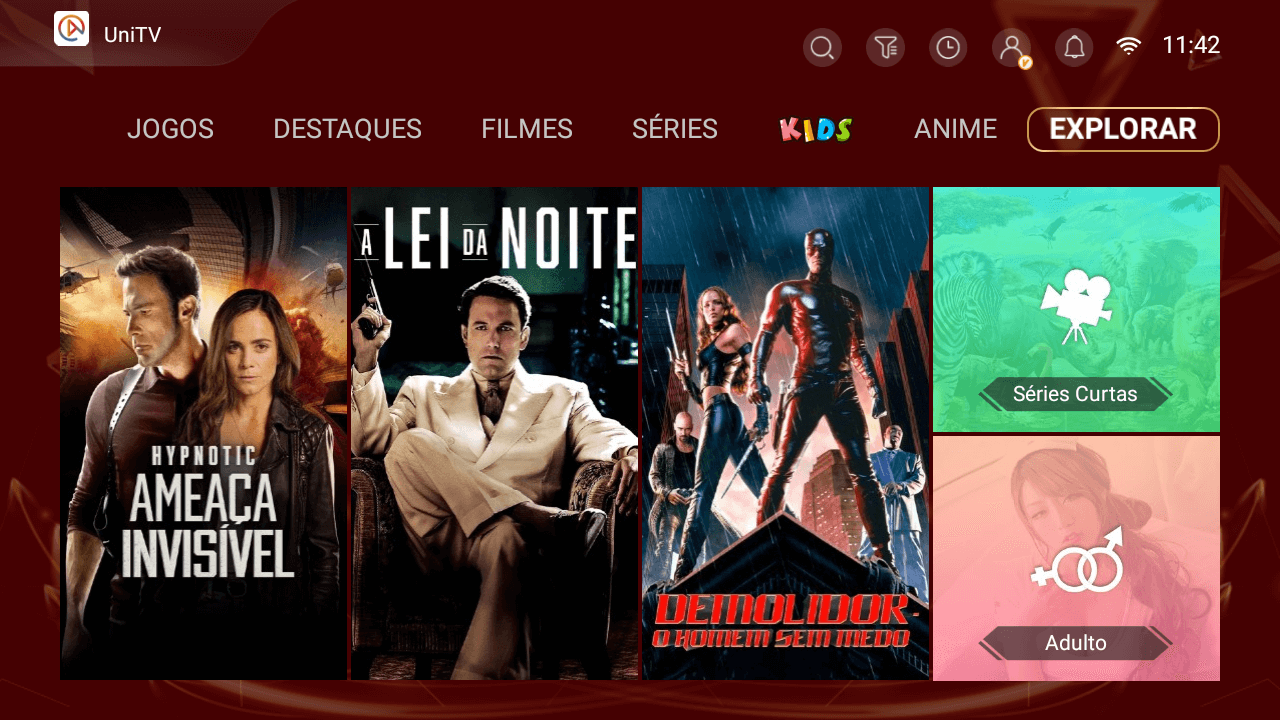 Tela Explorar do app UniTV: pôsteres de filmes e séries e um atalho para séries curtas.